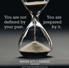Hour glass with sand moving down. Text reads: You are not defined by your past. You are prepared by it.